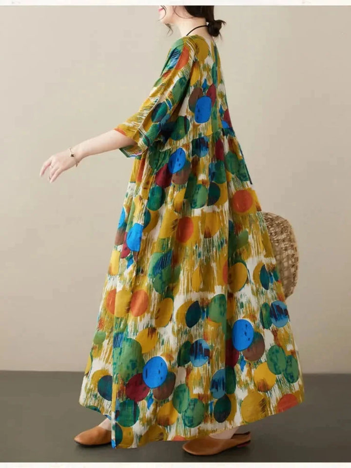 "Flowing boho maxi dress with artistic prints in soft cotton blend, perfect for a relaxed and stylish summer look."