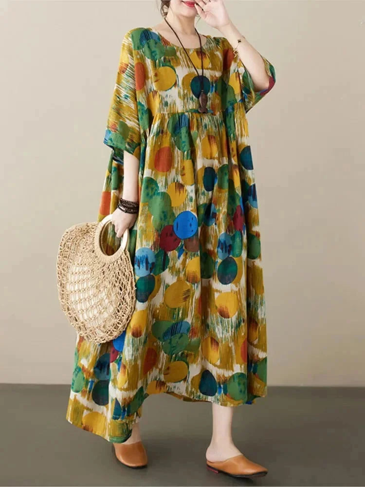 Flowy boho maxi dress in Green with artistic prints, made from lightweight and breathable fabric. Perfect for a laid-back…