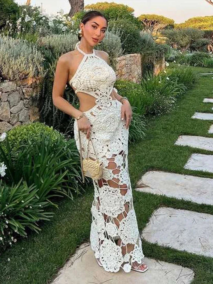 White crochet sleeveless maxi dress by Kylani, airy and intricate crochet design, perfect for sunny days or beach outings.