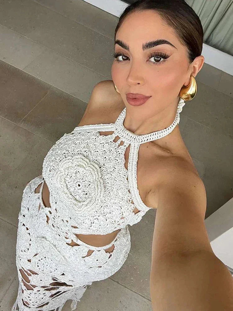 Sleeveless white crochet maxi dress by Kylani, featuring intricate crochet details and a flowing silhouette.