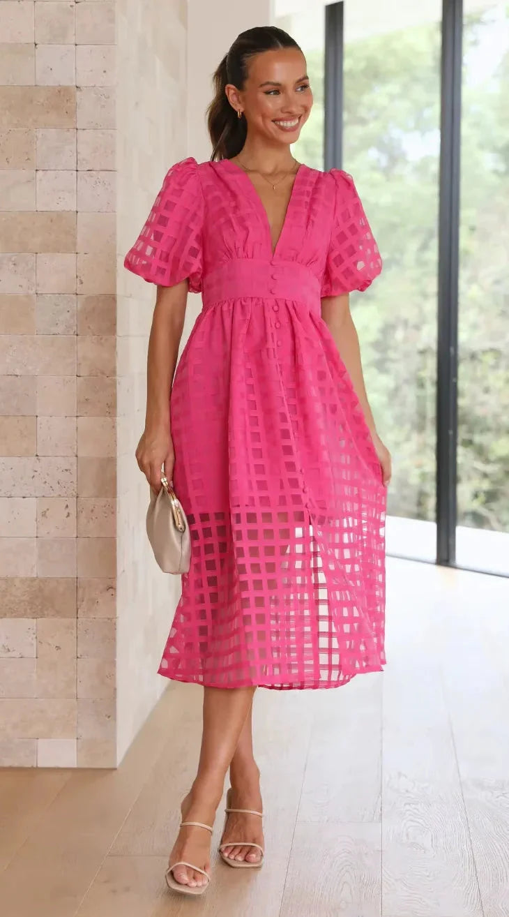 "Kyndal women's V-neck midi dress in textured fabric with a flattering silhouette."