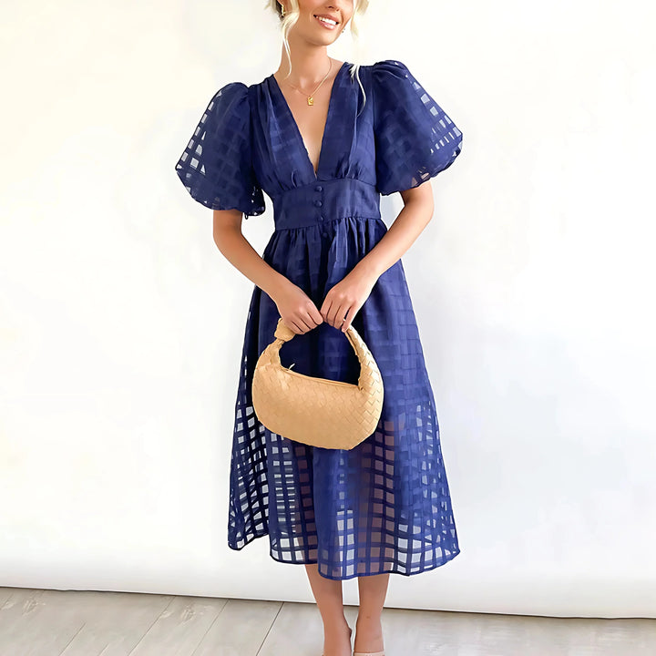 "Navy Blue midi dress for women with textured fabric and V-neck design, perfect for casual or formal occasions."