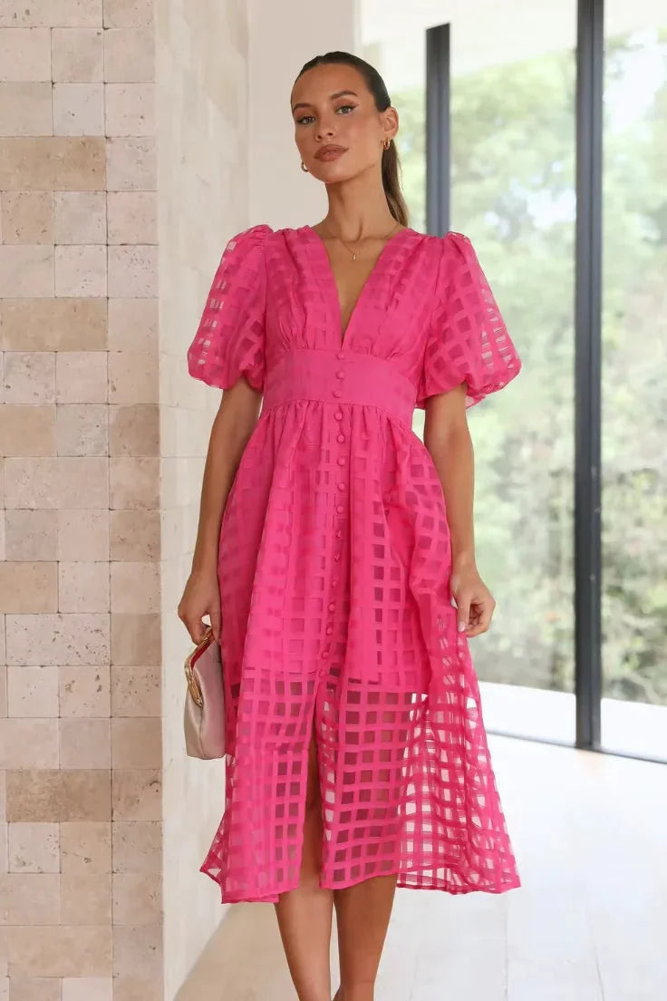 Pink textured V-neck midi dress for women, showcasing a modern design with a flattering silhouette - perfect for formal…