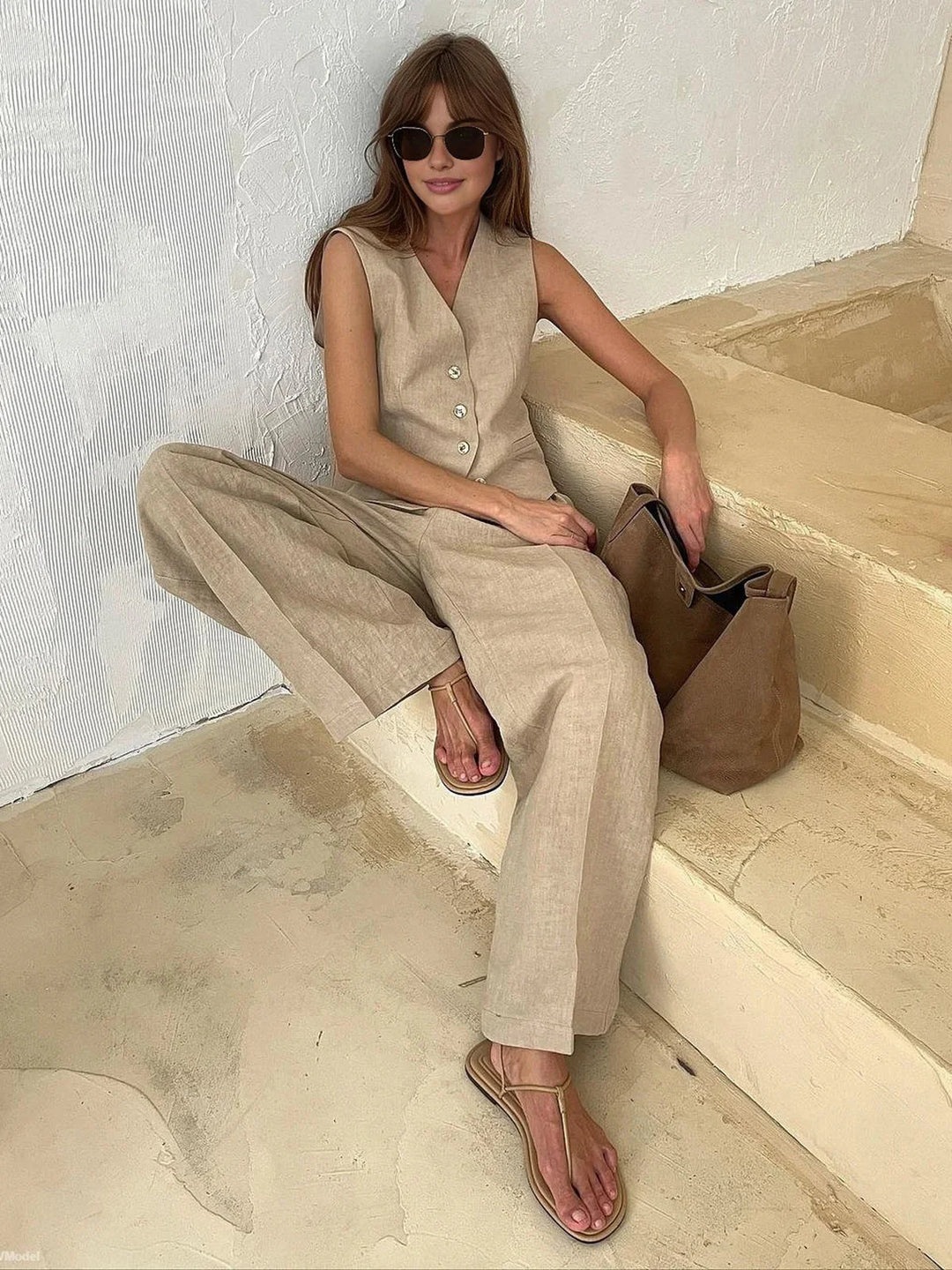 Sleeveless top and wide-leg pants set in lacey material, perfect for a chic and sophisticated look.