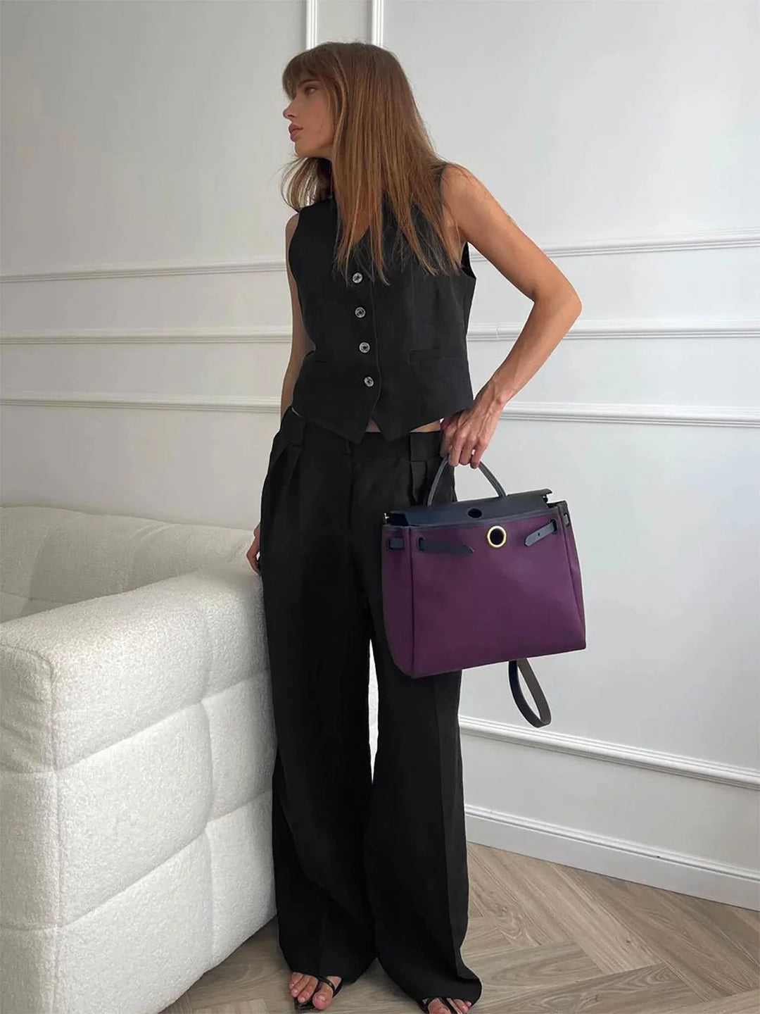 Sleeveless top and wide-leg pants set in Black. Featuring delicate lace detailing and a comfortable loose fit.