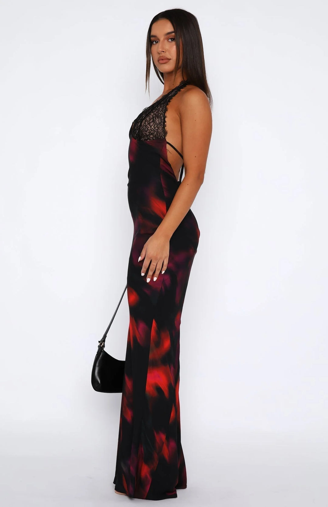 Black halter neck dress with intricate lace details at the waist and hem, crafted from a lightweight and breathable fabric.