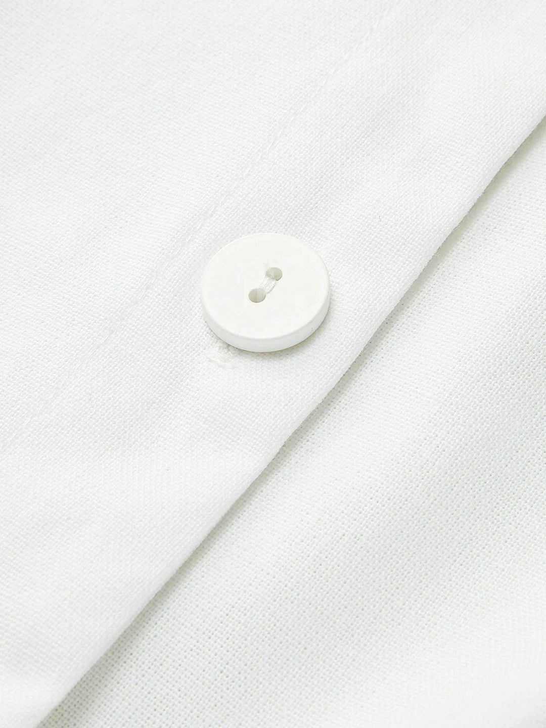 "Sleek sleeveless button-up collared shirt in soft cotton blend with modern design and versatile style by Lakelynn"