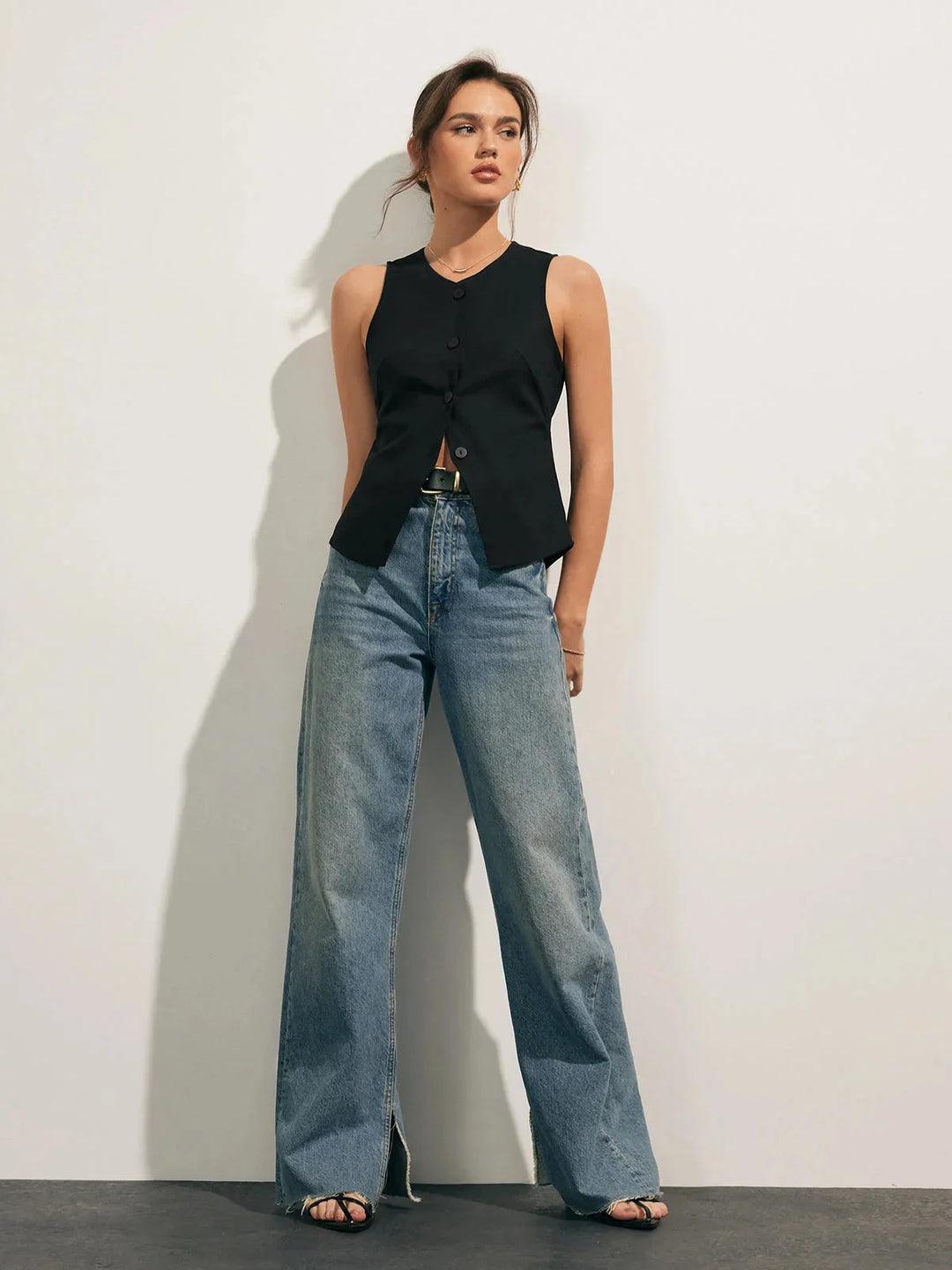 Sleeveless button-up collared shirt in sleek design with a structured fit, made from breathable cotton blend fabric in…