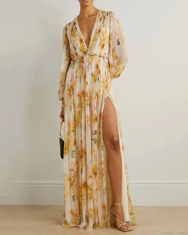 Yellow floral maxi dress for women with high slit. Features a lightweight and flowy design perfect for a casual yet elegant…