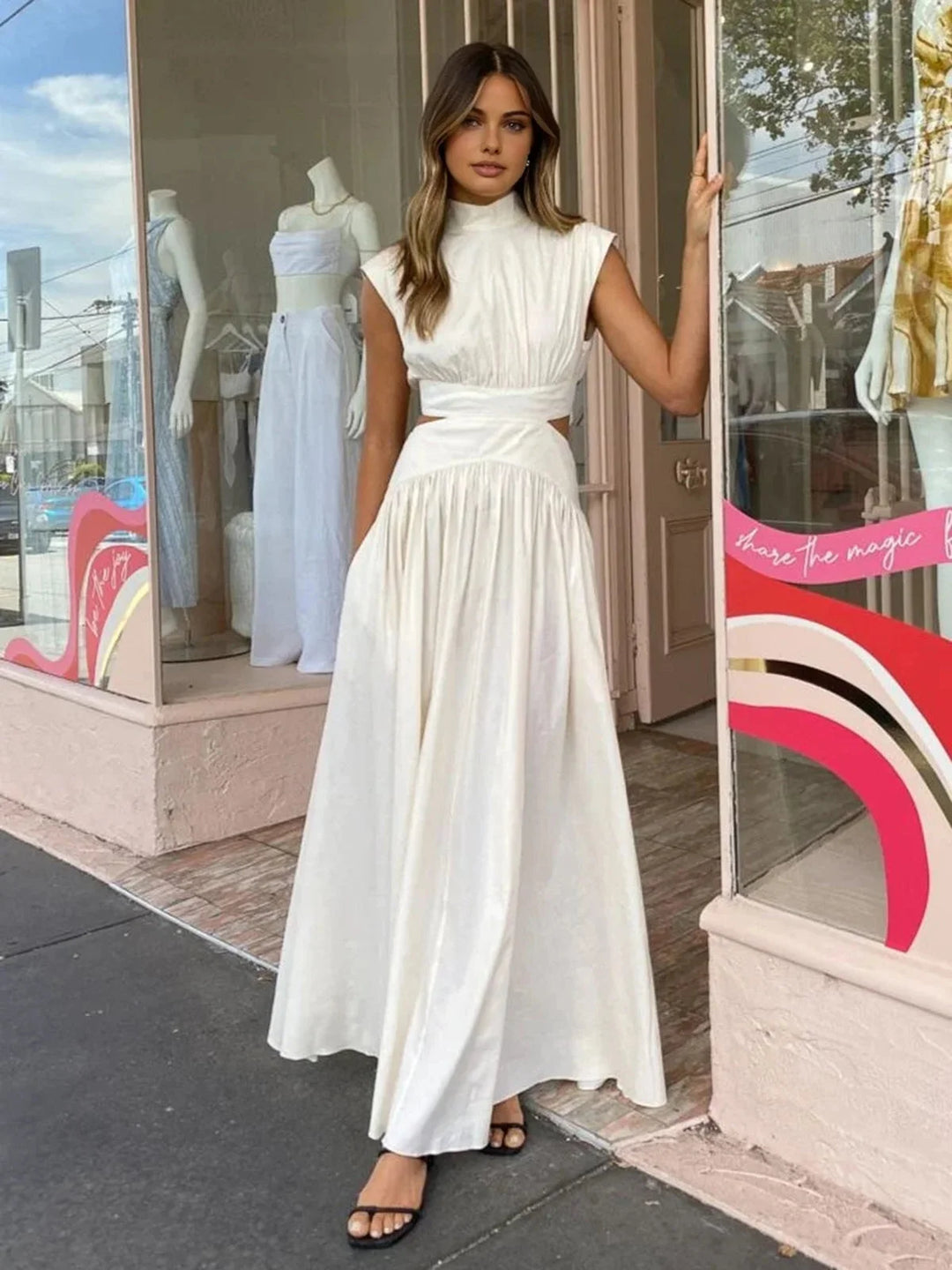 Sleeveless mock neck dress with cutouts in soft and stretchy fabric, perfect for casual or dressy occasions.