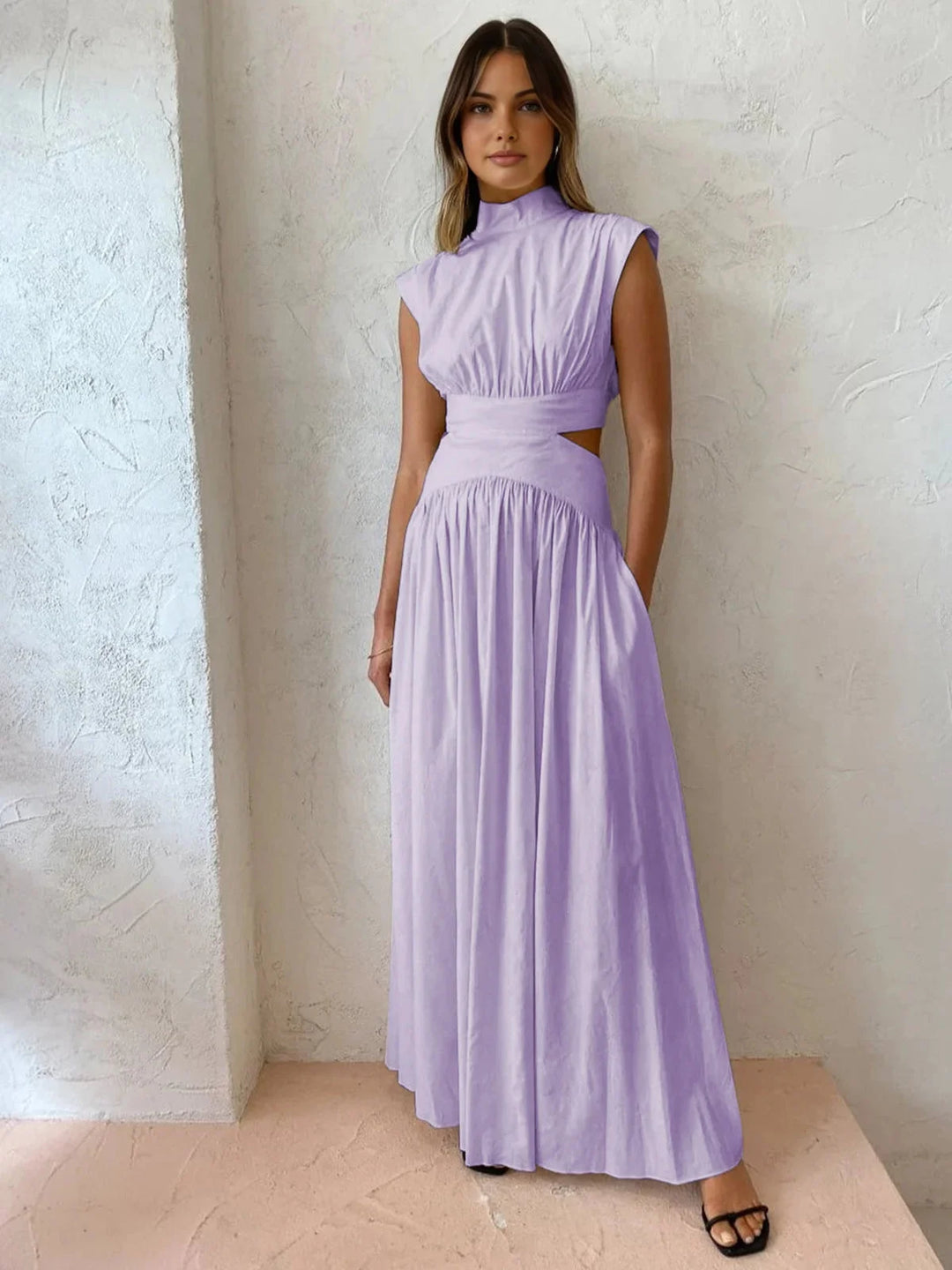 Sleeveless mock neck dress in purple with chic cutouts, made from soft and comfortable fabric, perfect for a stylish look.