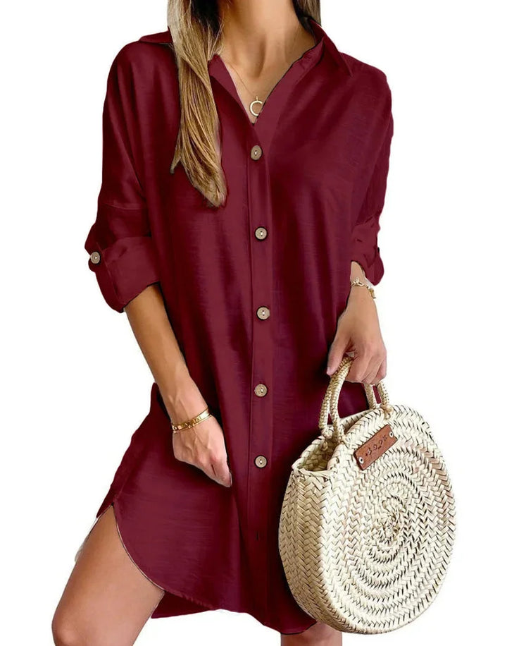 Black mini dress with button details made of soft cotton blend fabric. Chic and versatile addition to your wardrobe.
