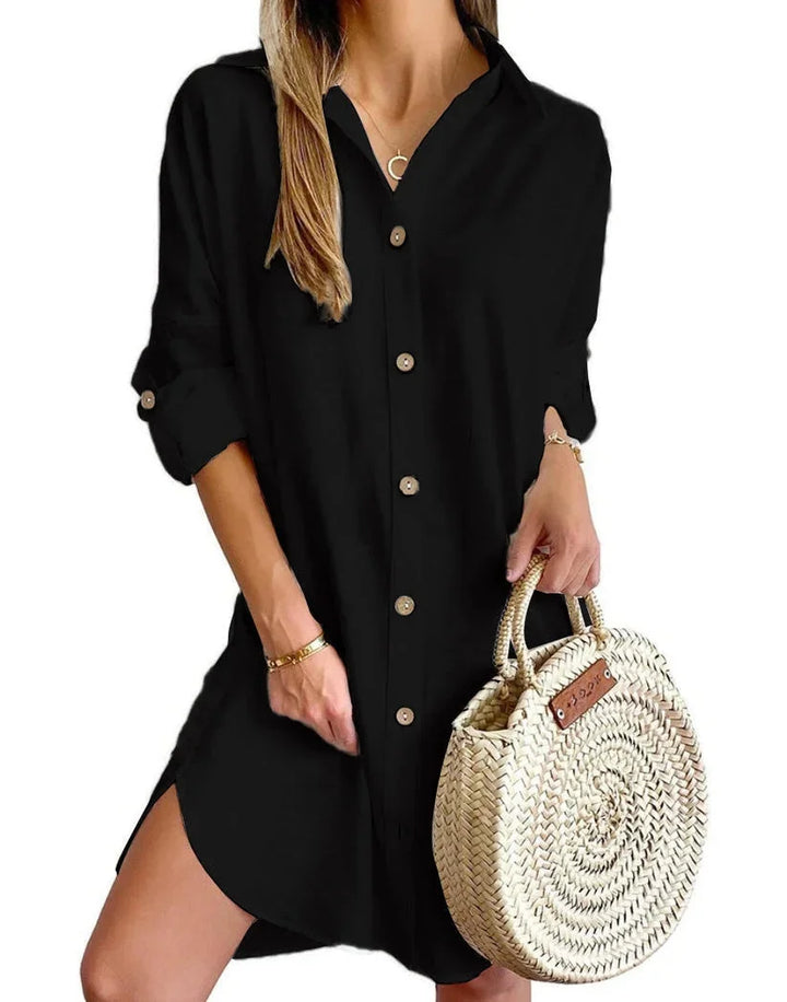 Black mini dress with button details made of lightweight fabric. Chic and stylish design perfect for any occasion.