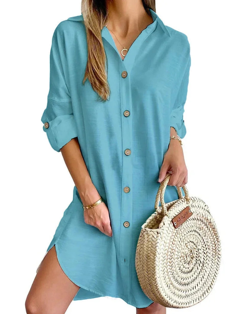 Blue green mini dress with button details made of soft, sustainable fabric. Simple yet stylish design for a chic look.