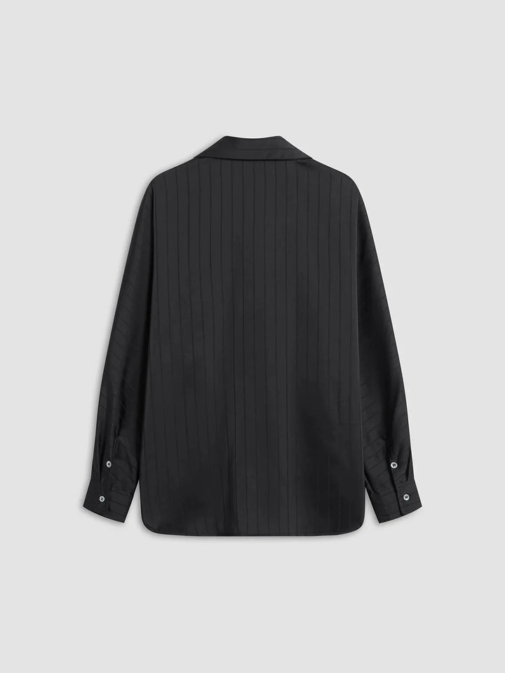 "Laylani button-up shirt with gold accents, featuring sleek design and quality fabric."