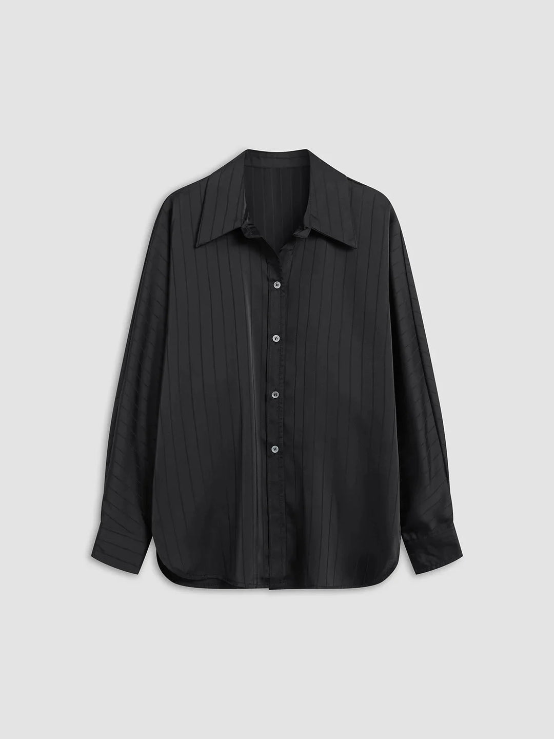 Button-up blouse in Laylani with gold accents, tailored design, and sleek silhouette for a sophisticated look.