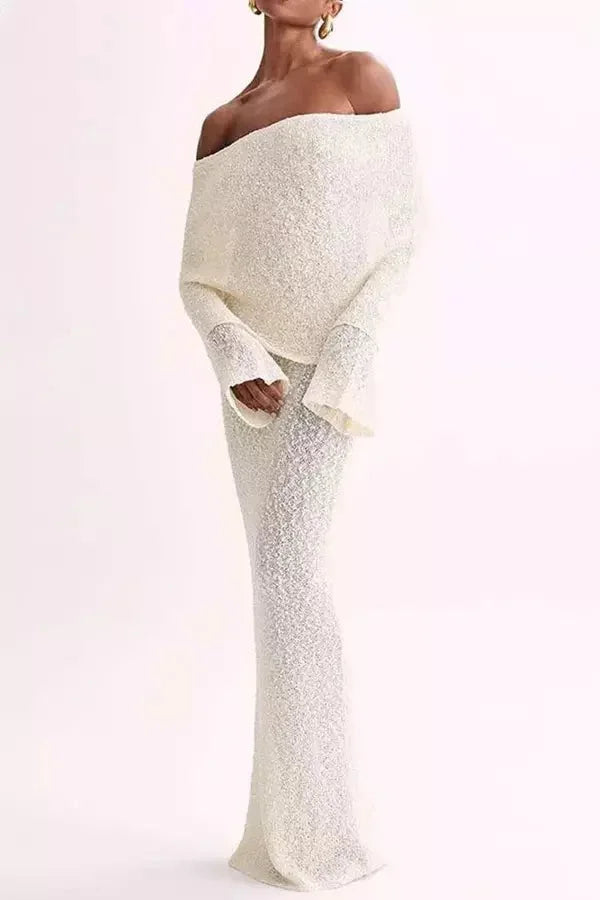 Off-shoulder dress with elegant sleeves, made from soft flowing fabric. Chic design ideal for any casual or special occasion.