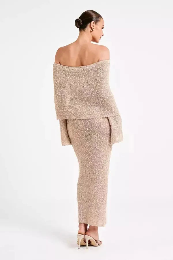 Off-shoulder dress in blush pink, featuring elegant bell sleeves, perfect for a chic and stylish look.
