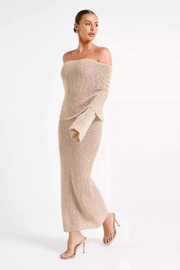Off-shoulder dress in Beige with elegant sleeves. Soft and flowy fabric for a chic and stylish look.