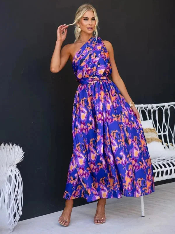 Purple flowy one-shoulder dress with belt, made from soft, high-quality fabric. Unique asymmetrical design for a stylish…