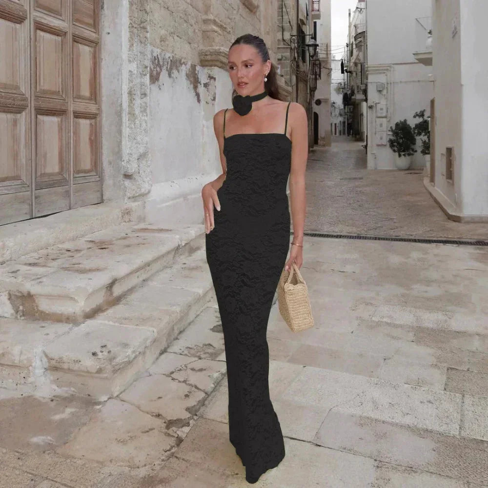 "Black lace maxi dress with fitted silhouette, featuring a sleek design. Perfect for special occasions."