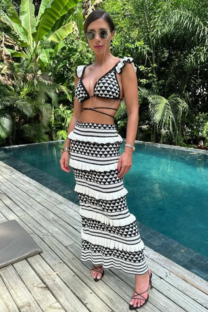 "Two-piece skirt set in black and white geometric print, made of soft and stretchy fabric."