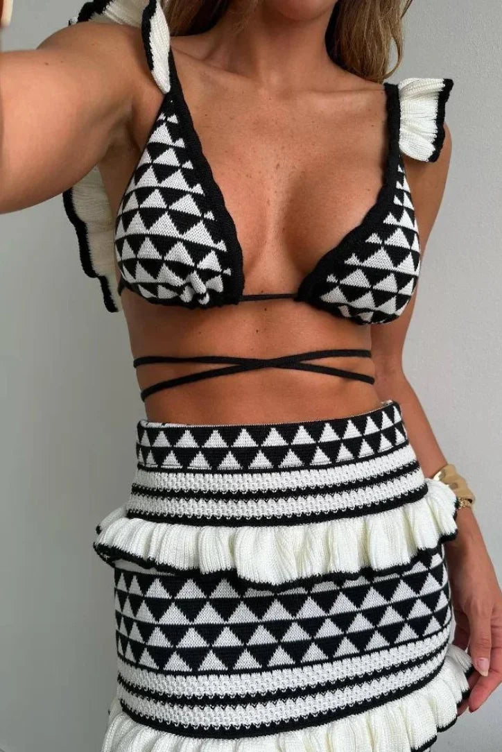 Black and white geometric two-piece skirt set by Linley showcasing a modern and stylish design with a unique pattern.