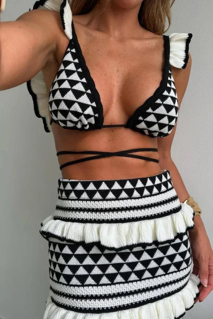 Black and white geometric two-piece skirt set by Linley showcasing a modern and stylish design with a unique pattern.