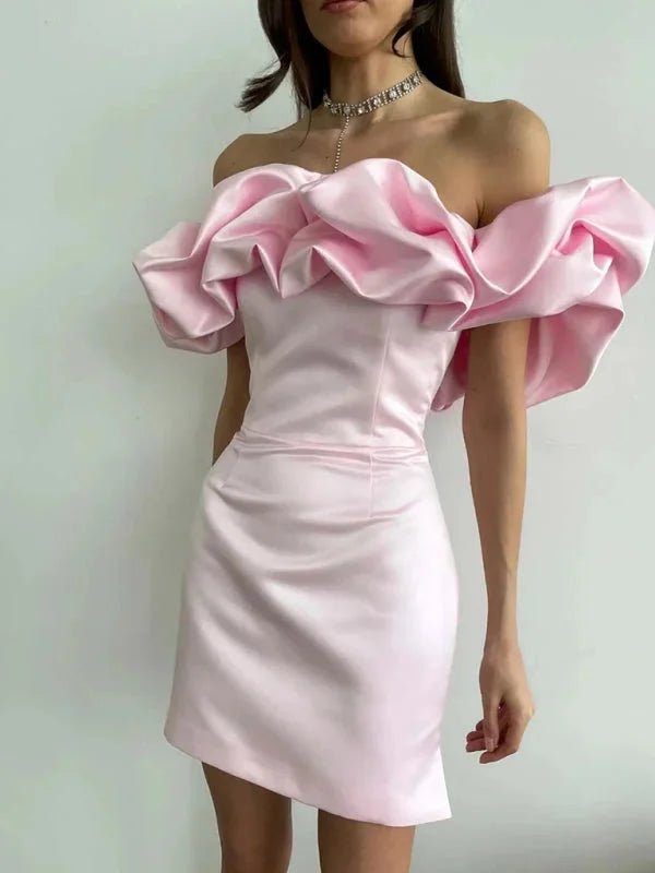 Pink fitted off-shoulder dress with dramatic ruffles, made from soft cotton blend fabric. Elegant, stylish design perfect…