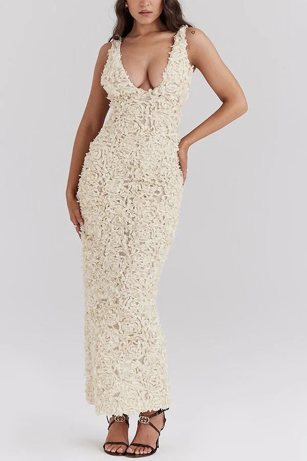 White floral backless maxi dress for women with intricate lace detailing and flowing silhouette.
