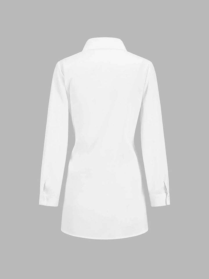 A versatile black blouse with adjustable front tie and buttoned cuffs, perfect for adding a touch of elegance to any outfit.