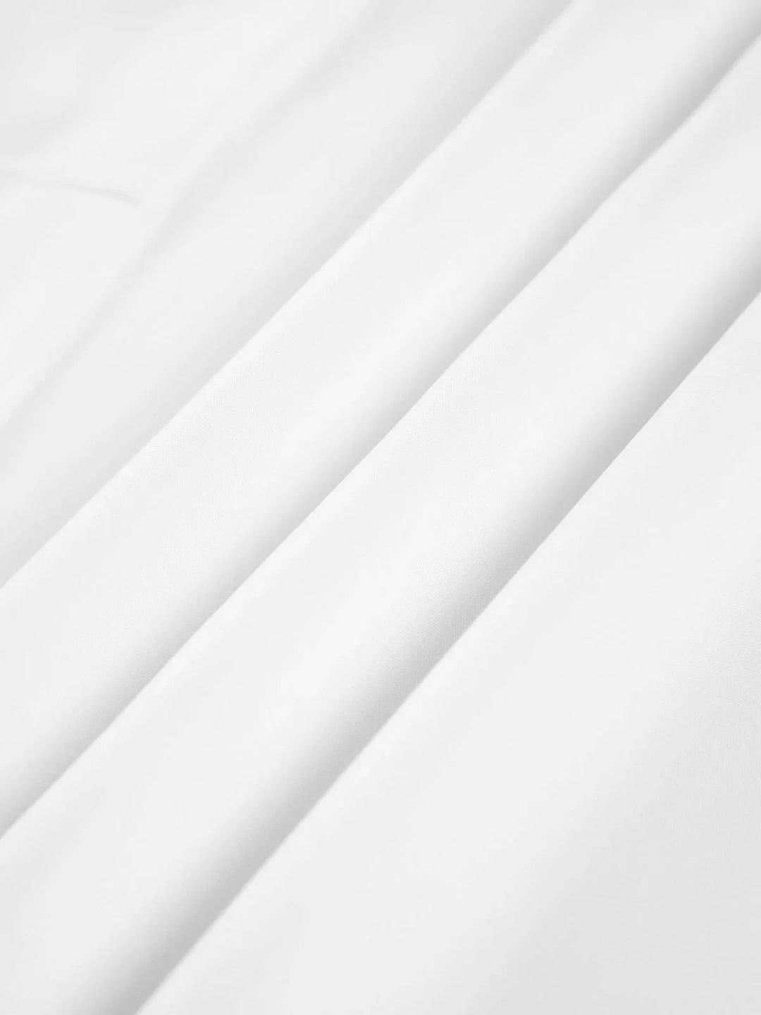 "White front-tie blouse with buttoned cuffs, made from soft and breathable fabric, featuring an adjustable design."