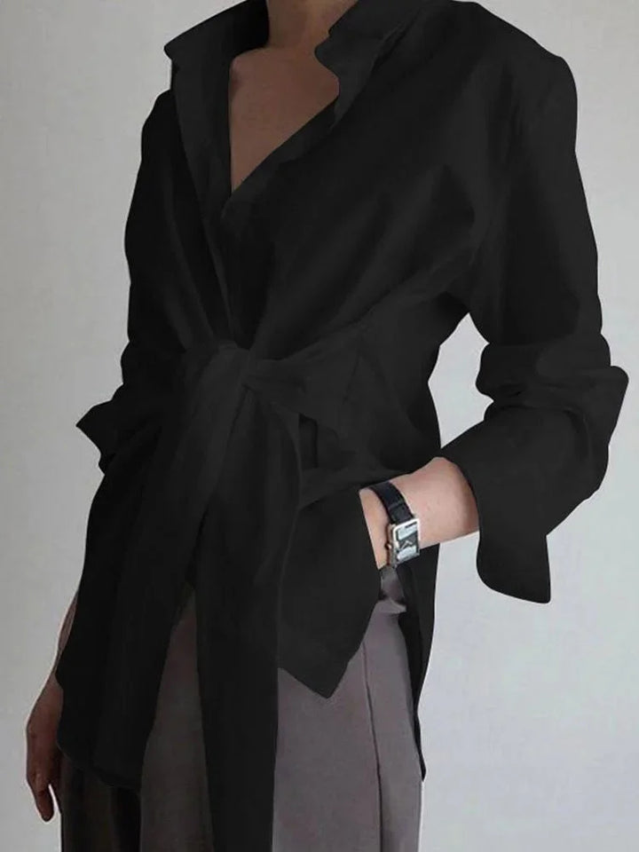 Black adjustable front-tie blouse with buttoned cuffs made of lightweight flowy fabric, perfect for casual or formal wear.