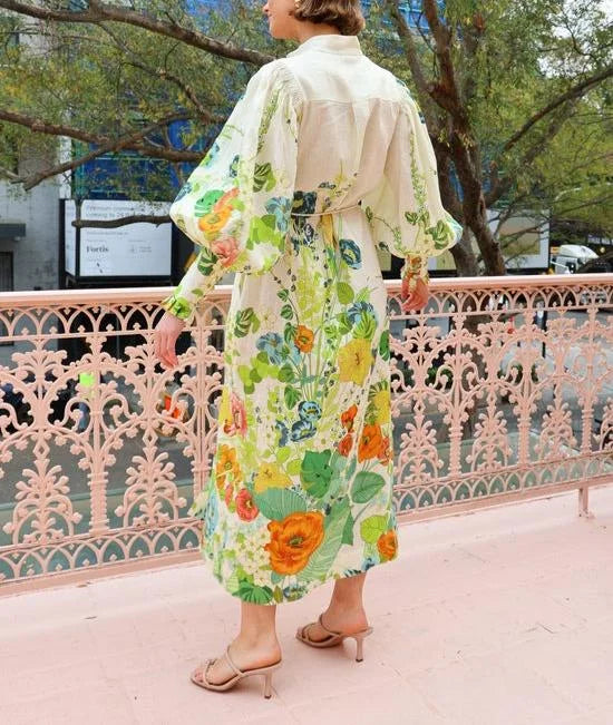 "Flowy maxi shirt dress with floral pattern in lightweight fabric, perfect for a breezy summer day."