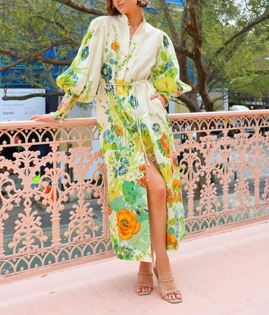 Flowy maxi shirt dress in Madelyn with a colorful floral pattern on a lightweight, airy fabric.
