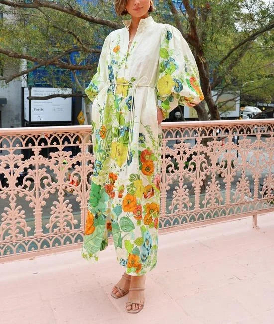 Alt text: Flowy maxi shirt dress in floral pattern, with lightweight fabric and elegant design.