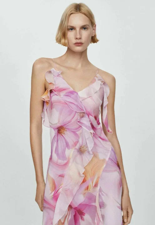 Floral asymmetric dress with ruffles in a lightweight chiffon fabric, featuring a unique and elegant design by Maelee.