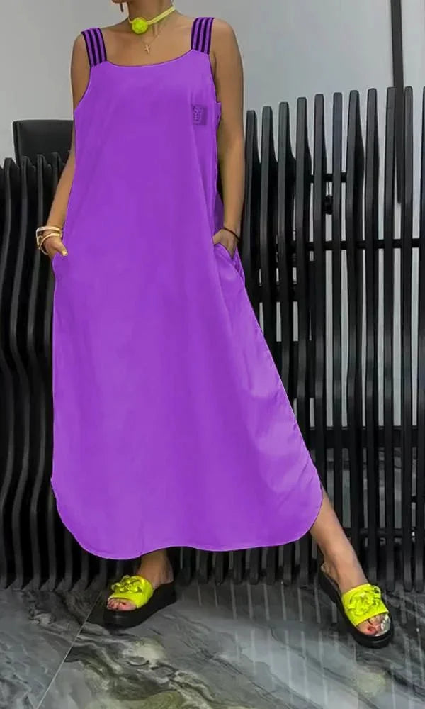 Sleeveless maxi dress in Purple with pockets. Features a relaxed fit silhouette.