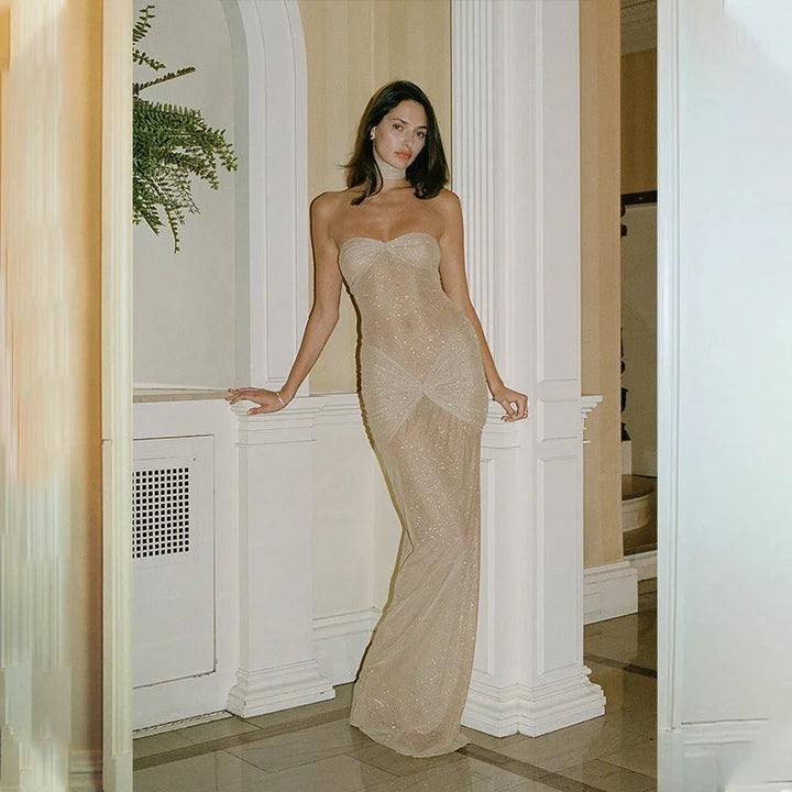 Apricot strapless women's maxi dress with shimmer, perfect for special occasions. Soft and flowy fabric with a sparkly…