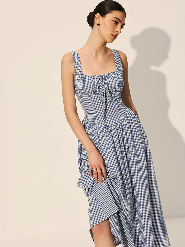 "Sleeveless navy gingham cotton maxi dress, a classic and elegant choice for any casual occasion."