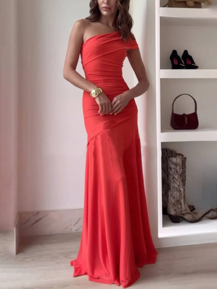Off-shoulder maxi dress in soft chiffon fabric with elegant ruched detailing, perfect for formal events and special…