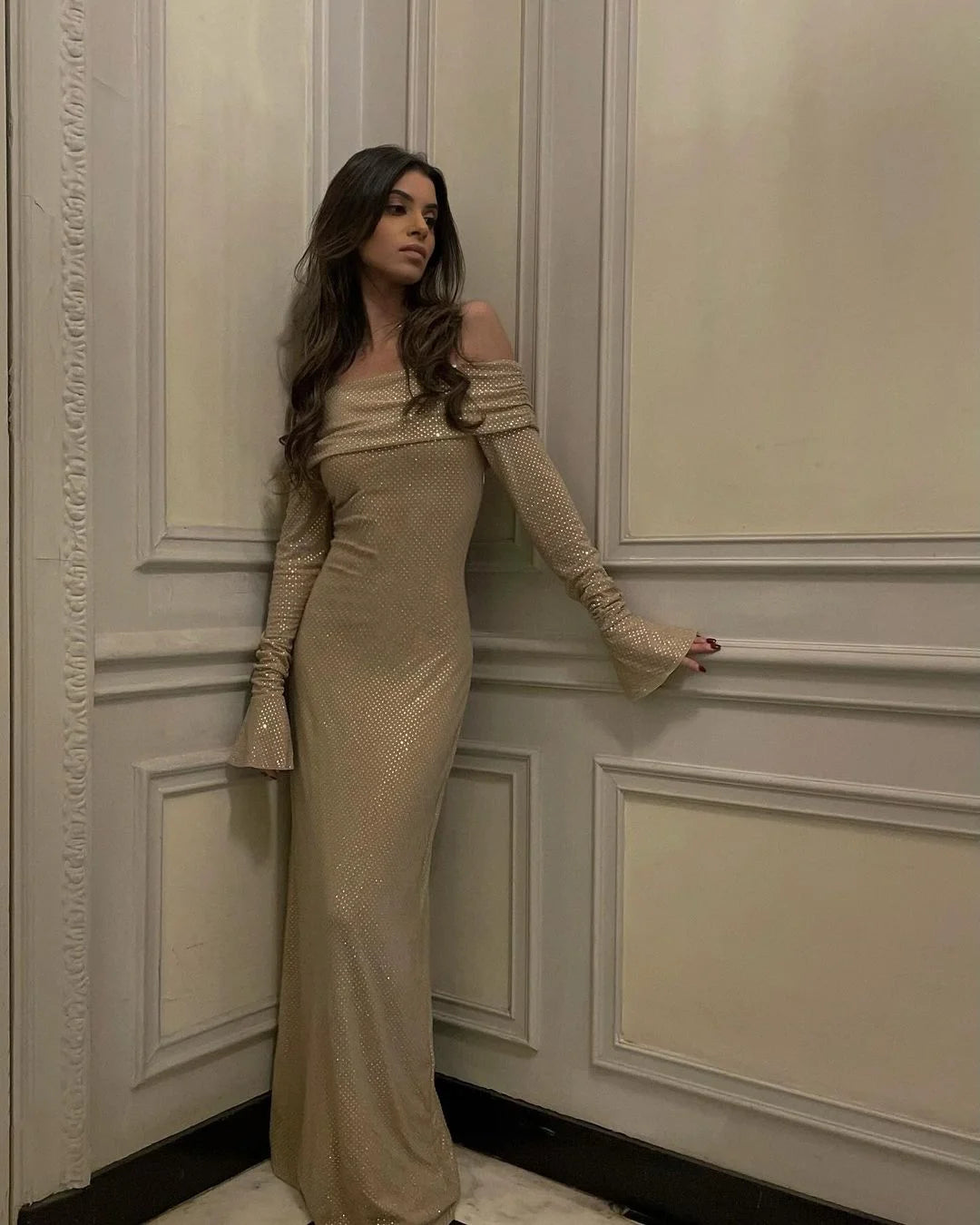 Beige off-shoulder dress with a sparkling glitter finish, perfect for formal events or parties with its elegant and chic…