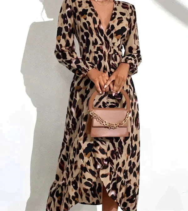 Leopard print wrap dress with long sleeves, featuring a bold and trendy design - perfect for making a statement.