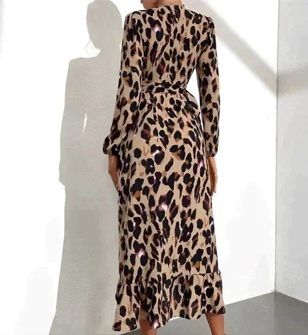 Long-sleeve leopard print wrap dress, showcasing a bold print on soft, flowy fabric with a flattering wrap design.