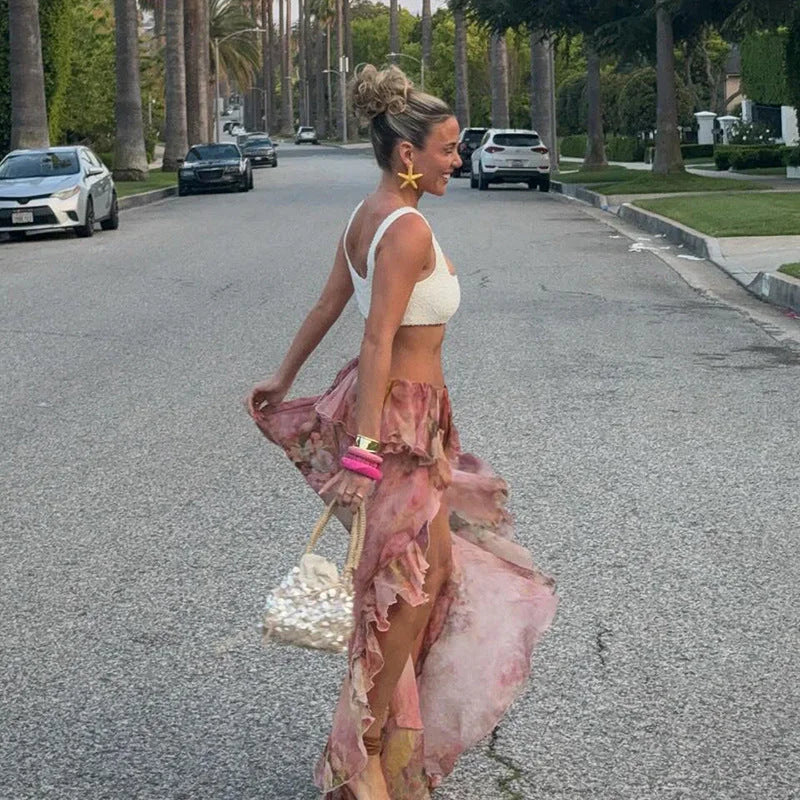 Pink skirt with floral print and unique asymmetric design, perfect for a casual yet stylish look.