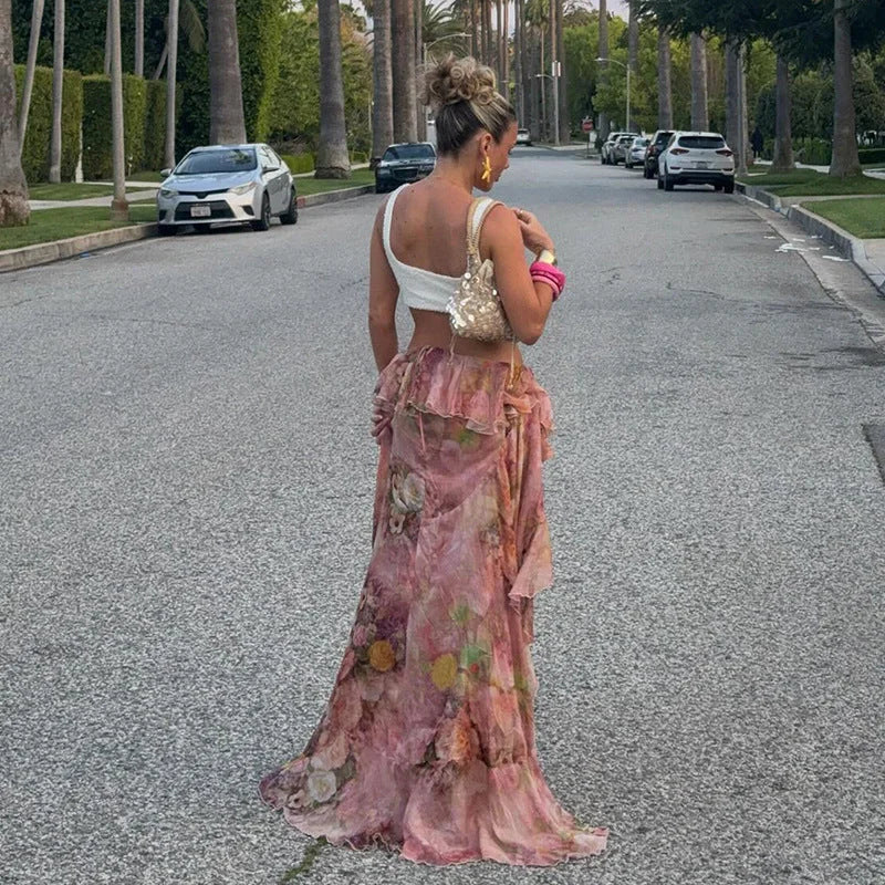 Pink floral-print skirt with asymmetrical cut, perfect for effortless chic summer looks.