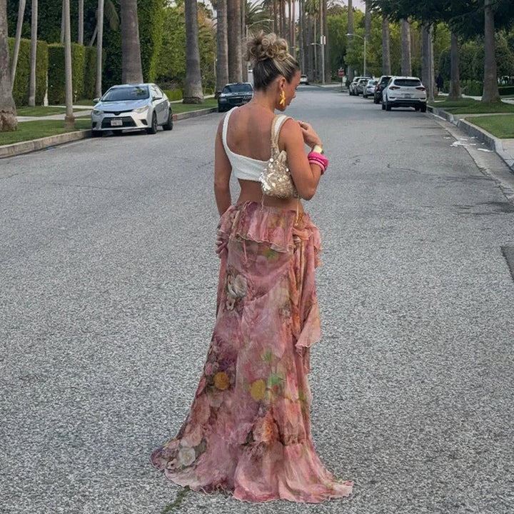 Pink floral-print skirt with asymmetrical cut, perfect for effortless chic summer looks.