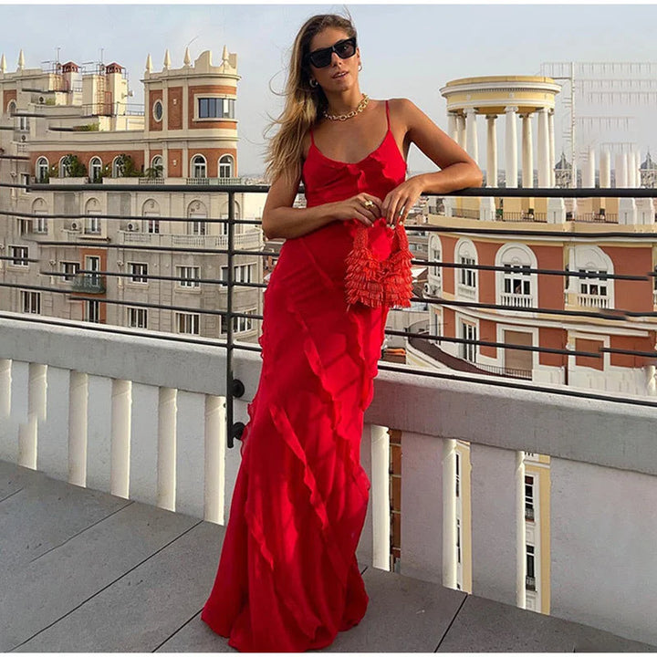 Asymmetrical strap maxi dress with ruffle detail, ideal for elegant occasions, made from flowy fabric in Marbella design.