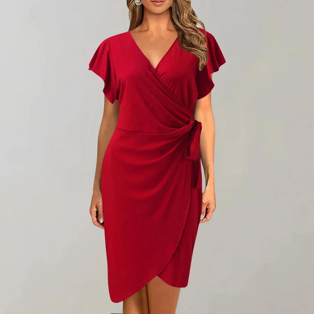 Black V-neck wrap-style dress with flutter sleeves. Made of soft jersey fabric for a flattering silhouette. Perfect for any…