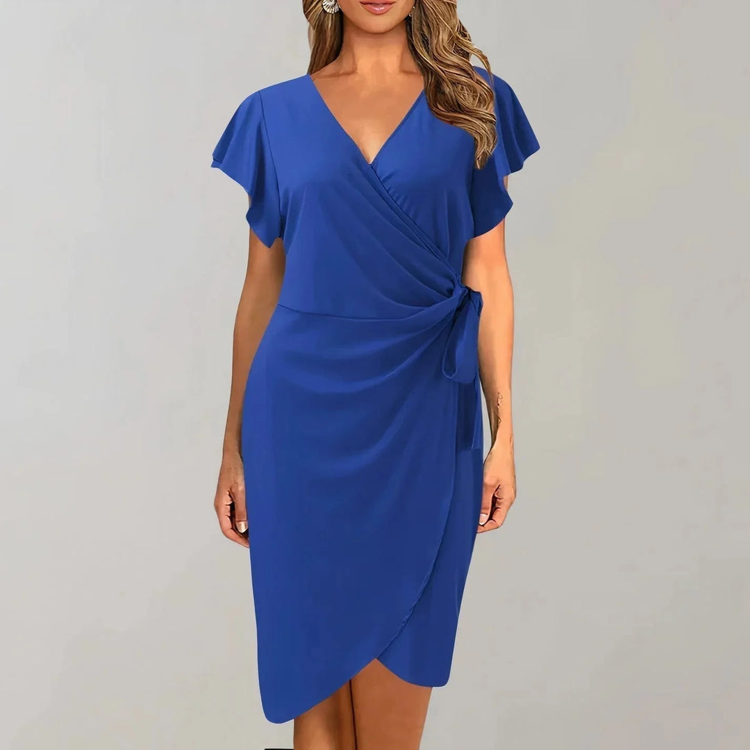 Blue V-neck wrap-style flutter sleeve dress made with soft, flowing fabric. Timeless and elegant design perfect for any…